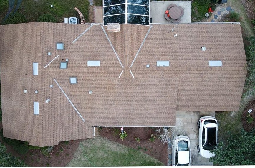 Same shingle roof after soft wash cleaning, clean and uniform